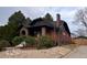 Charming two-story brick home featuring a classic design, well-kept landscaping, and inviting curb appeal at 2636 N Glencoe St, Denver, CO 80207