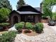 Charming brick home featuring mature landscaping, a covered porch, and inviting curb appeal at 2636 N Glencoe St, Denver, CO 80207