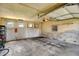 Spacious garage with vintage doors, an opener and cement floor at 2636 N Glencoe St, Denver, CO 80207