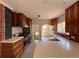 Bright kitchen featuring custom wood cabinets, modern stainless steel appliances and white countertops at 2636 N Glencoe St, Denver, CO 80207