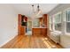 Open kitchen with custom wood cabinets, hardwood floors, and ample natural light, perfect for entertaining guests at 2636 N Glencoe St, Denver, CO 80207