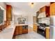 Bright kitchen with white countertops, custom wood cabinets, and stainless steel appliances, perfect for Gathering cooking at 2636 N Glencoe St, Denver, CO 80207