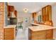 Modern kitchen featuring custom wood cabinetry, white countertops, and stainless steel appliances, great for cooking at 2636 N Glencoe St, Denver, CO 80207