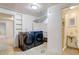 Finished laundry room with modern washer and dryer, tile floor, and access to a half bathroom at 2636 N Glencoe St, Denver, CO 80207