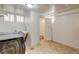 Bright laundry room featuring utility sink and adjacent toilet at 2636 N Glencoe St, Denver, CO 80207