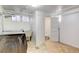 Laundry area with tile flooring, washer, dryer, utility sink, and a view into a compact bathroom at 2636 N Glencoe St, Denver, CO 80207