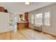 Refinished hardwood floors throughout this open floor plan, featuring a full kitchen and living room at 2636 N Glencoe St, Denver, CO 80207