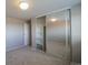 Second bedroom with mirrored closet and neutral decor at 1029 E 8Th Ave # 907, Denver, CO 80218