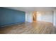 Bright living room with hardwood floors and access to kitchen at 1029 E 8Th Ave # 907, Denver, CO 80218