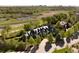 Aerial view of a home with a lake, river, and tree-lined grounds, with a city skyline in the distance at 5470 S Highline Cir, Greenwood Village, CO 80121