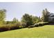 Sprawling backyard with a well-maintained lawn and lush greenery, offering a serene outdoor space at 5470 S Highline Cir, Greenwood Village, CO 80121