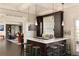 Well-appointed bar area with counter seating, dark cabinetry, and seamless access to the living room at 5470 S Highline Cir, Greenwood Village, CO 80121