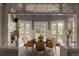 Elegant dining area featuring a round table with seating for six and view to the outside at 5470 S Highline Cir, Greenwood Village, CO 80121