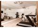 Well-equipped home gym with treadmills, bikes, and mirrored wall for a complete workout space at 5470 S Highline Cir, Greenwood Village, CO 80121