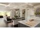 Spacious kitchen area with marble counters, stainless appliances and seamless access to the living room at 5470 S Highline Cir, Greenwood Village, CO 80121