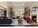Bright living room featuring a fireplace, coffered ceilings, and large windows offers an inviting space at 5470 S Highline Cir, Greenwood Village, CO 80121
