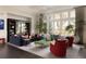 Bright living room with large windows, plush seating, stylish decor, and ample natural light at 5470 S Highline Cir, Greenwood Village, CO 80121