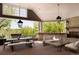 Inviting outdoor living space with comfortable seating and fireplace overlooking lush greenery at 5470 S Highline Cir, Greenwood Village, CO 80121