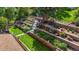 Aerial view of multi-tiered backyard with retaining walls, flowerbeds, and access stairs at 5425 Camargo Rd, Littleton, CO 80123