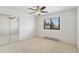 Clean, sunlit bedroom with mirrored closet and ceiling fan at 5425 Camargo Rd, Littleton, CO 80123