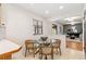 Cozy breakfast nook featuring a glass table and seating, adjacent to the kitchen and living area at 5425 Camargo Rd, Littleton, CO 80123