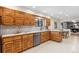 Spacious kitchen with wood cabinets, stainless steel appliances, and ample counter space for meal preparation at 5425 Camargo Rd, Littleton, CO 80123