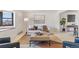 Bright living room featuring neutral colors, large window, modern furniture, and stylish decor at 5425 Camargo Rd, Littleton, CO 80123