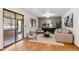 Stylish living room with hardwood floors, contemporary furniture, and sliding glass doors to the outside at 5425 Camargo Rd, Littleton, CO 80123