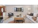 Inviting living room with bay window, stylish furniture, and decor, creates a cozy atmosphere at 5425 Camargo Rd, Littleton, CO 80123