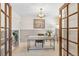 Bright office space featuring a modern desk, stylish lighting, and shelving for storage and decor at 5425 Camargo Rd, Littleton, CO 80123