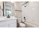 Bathroom with vanity, dark fixtures, combination tub and shower with white tile surround at 2537 Lupton Ln, Lafayette, CO 80026