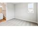 Bedroom with neutral carpet and adjacent ensuite bathroom for a calm, relaxing atmosphere at 2537 Lupton Ln, Lafayette, CO 80026