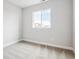 This bedroom features neutral carpet, ample natural light from a large window at 2537 Lupton Ln, Lafayette, CO 80026