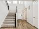 Elegant entryway with hardwood floors, staircase, and natural light creating a welcoming atmosphere at 2537 Lupton Ln, Lafayette, CO 80026