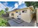 Exterior view of backyard with a yellow house at 109 6Th St, Fort Lupton, CO 80621