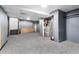 Unfinished basement with gray walls and carpeted floors at 109 6Th St, Fort Lupton, CO 80621
