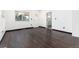 Bright bedroom featuring dark wood floors and multiple windows for ample natural light at 109 6Th St, Fort Lupton, CO 80621