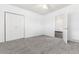 Bedroom with carpeted floors and closet with bi-fold doors at 109 6Th St, Fort Lupton, CO 80621