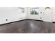 Spacious bedroom featuring rich dark wood floors and natural light from the windows at 109 6Th St, Fort Lupton, CO 80621