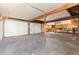 Interior view of an unfinished two-car garage with a concrete floor at 109 6Th St, Fort Lupton, CO 80621