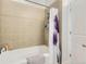 Bathroom featuring a shower-tub combo with tiled walls and a white shower curtain at 5401 S Park Terrace Ave # 301C, Greenwood Village, CO 80111