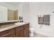 Bathroom featuring a vanity with granite countertop, a mirror, and a toilet at 5401 S Park Terrace Ave # 301C, Greenwood Village, CO 80111