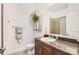 Bathroom featuring a modern vanity with granite countertop, mirror, and hanging plant for a spa-like feel at 5401 S Park Terrace Ave # 301C, Greenwood Village, CO 80111