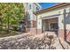 Exterior view of building entrance featuring brick and stucco with building and unit access at 5401 S Park Terrace Ave # 301C, Greenwood Village, CO 80111