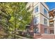 A well-maintained exterior showcasing brick and stucco architecture, complemented by green landscaping at 5401 S Park Terrace Ave # 301C, Greenwood Village, CO 80111