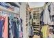 Spacious walk-in closet with shelves and hanging racks for optimal storage solutions at 5401 S Park Terrace Ave # 301C, Greenwood Village, CO 80111