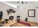 Bright home gym featuring hardwood floors, a mirror, and hexagonal wall shelves with plants at 5401 S Park Terrace Ave # 301C, Greenwood Village, CO 80111