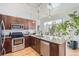 Modern kitchen with stainless steel appliances, granite countertops, and natural light at 5401 S Park Terrace Ave # 301C, Greenwood Village, CO 80111