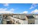 An aerial view shows modern townhome development with rooftop decks, blending urban living and outdoor space at 2622 W 24Th Ave # 2, Denver, CO 80211