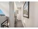 Hallway showcasing wood flooring and views to the exterior with a modern railing at 2622 W 24Th Ave # 2, Denver, CO 80211